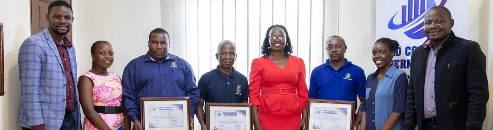 The Ayad Consults team with delegates holding their certificates